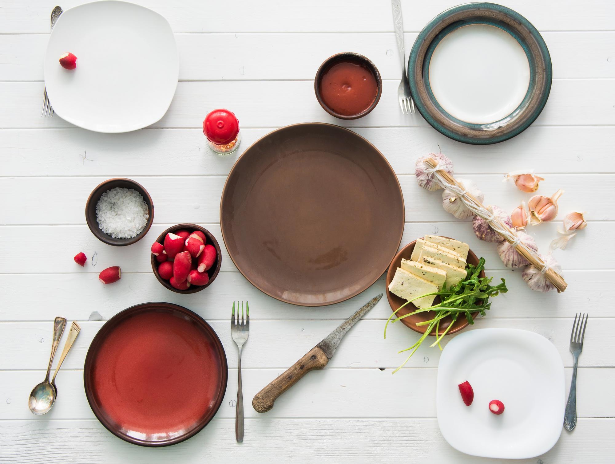 Flat lay of three plated dishes representing packages
